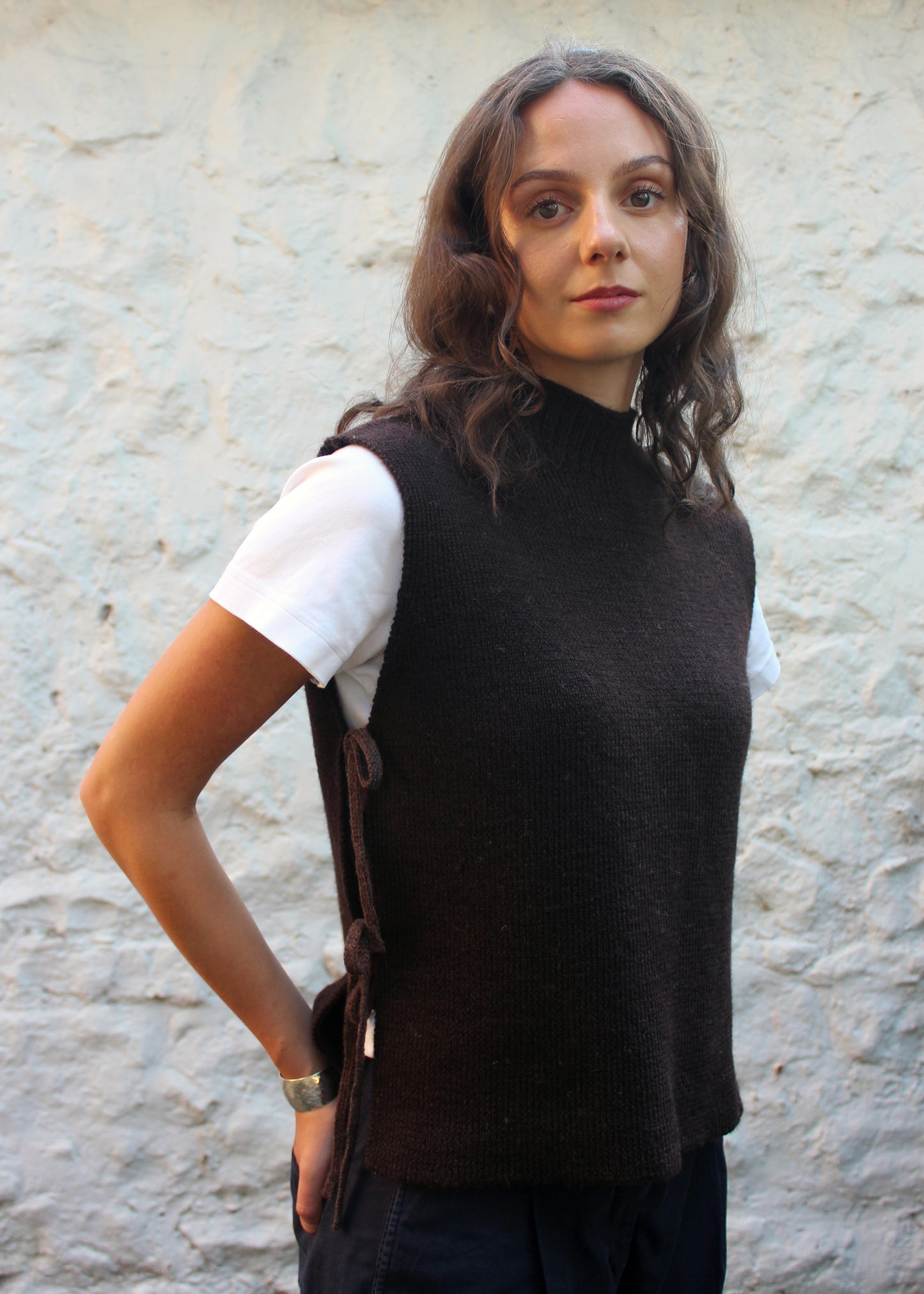 Model in brown wool vest.